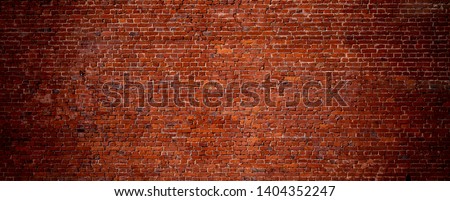 Large Old Red Brick Wall Background. Wide Angle Vintage Brick Texture. Panoramic Web banner or Wallpaper With Copy Space.