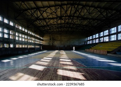 Large old ruined gymnasium in abandoned school. - Shutterstock ID 2239367685