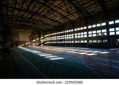 Large old ruined gymnasium in abandoned school. - Shutterstock ID 2239692485
