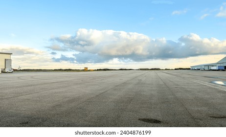 A large open parking space on an airport.