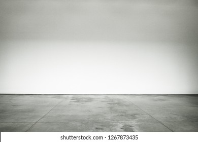 Large Open Room Polished Cement Floor And The Walls Are Painted White