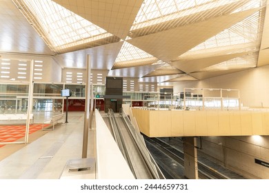 A large, open space with a lot of windows and a lot of light. The space is designed to be very functional and efficient. Zaragoza train station