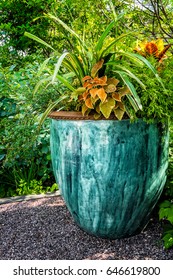 Large Outdoor Potted Plant. Beautiful Pot Glazed In Shades Of Blue And Teal With Assorted Foliage Plants.