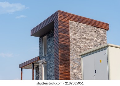 A Large Outdoor Power Supply Cabinet And Substation Next To A Residential Building Under Construction Against The Sky.