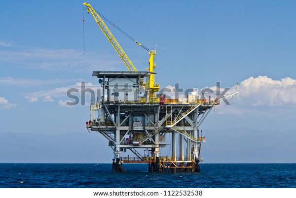 Large Pacific Ocean offshore oil rig\
drilling platform off the southern coast of California, between\
Ventura and the Channel Islands, circa September\
2012