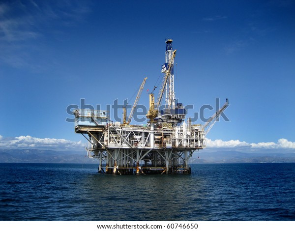 Large Pacific Ocean\
offshore oil rig drilling platform off the southern coast of\
California. Circa 2007.