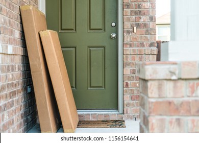 Large packages in cardboard boxes waiting for home owner to come home from work
