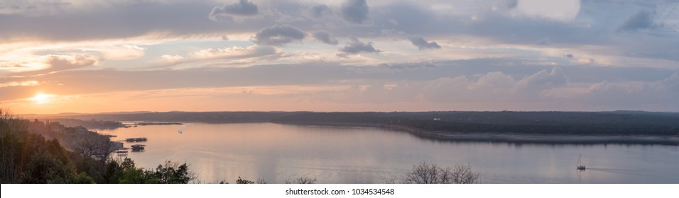 Large Panorama of Sunset Over Lake Travis Texas with Sail Boat on the side