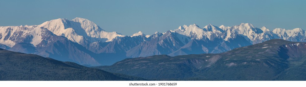 Large panorama. View of the snow-capped mountain range. - Shutterstock ID 1901768659