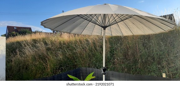Large parasol in the garden - Shutterstock ID 2192021071
