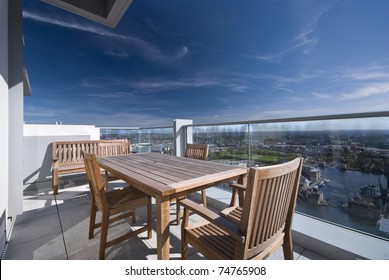 Large Penthouse Terrace With Dining Table And Chairs With City Views