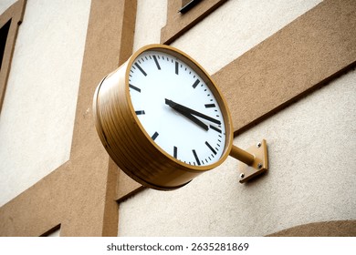 Large physical clock at a train station stands as a timeless symbol of travel and precision, marking every moment in the heart of transit.

