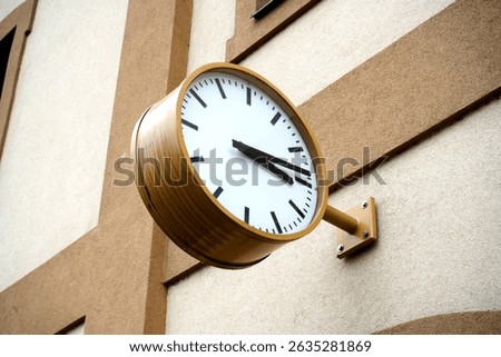 Large physical clock at a train station stands as a timeless symbol of travel and precision, marking every moment in the heart of transit.

