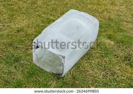 A large piece of ice in the shape of a rectangular parallelepiped
