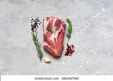 Large Piece Raw  Meat With Salt, Pepper, Rosemary And Spices. Preparing Ham Beef Lamb For A Family Lunch Or Dinner. New Year Christmas Holiday Food Top View