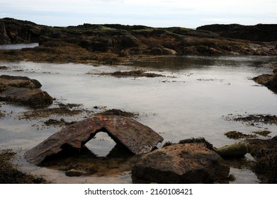 Large Piece Of Submarine Ship Wreck Washed Up Into Rock Pools By Storms