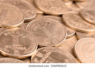 Large pile of big golden coins. Financial success money background for rich life concepts, banking and profit in Ukraine - Powered by Shutterstock