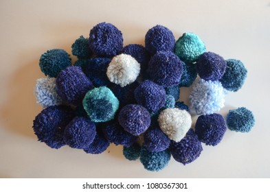 A Large Pile Of Blue Handmade Yarn Pom Poms, Texture And Bright Colors, Flat Lay/from Above Style