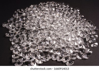 A Large Pile Of Brilliant Diamonds On A Black Background 