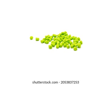 Large pile of crappie bites bait in chartreuse color isolated on white background. Artificial fishing bait fit on crappie hooks.