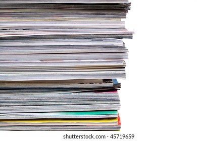 A Large Pile Of Magazines Stacked High. Isolated Over White With Copyspace.