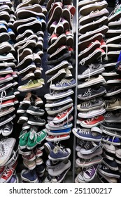 A Large Pile Of Old Worn Sneakers, Shoes