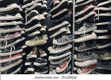 A Large Pile Of Old Worn Sneakers, Shoes