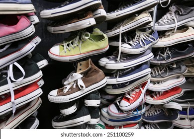 A Large Pile Of Old Worn Sneakers, Shoes