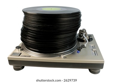 A Large Pile Of Records Stacked On Top Of Each Other On A Technics Turntable