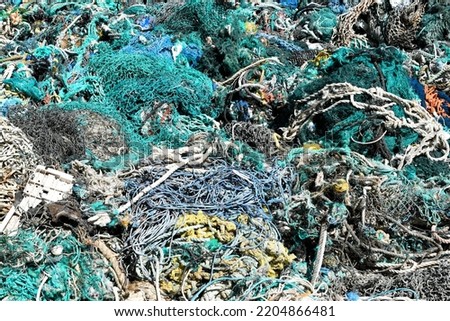 A large pile of trawler fishing nets, ropes and debris dredged up from the  Port of Los Angeles. Fishing nets are a major source of ocean pollution.