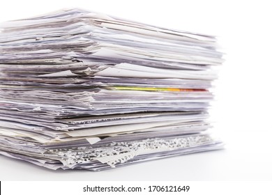 Large pile of waste paper isolated on white. Ready for recycling - Shutterstock ID 1706121649