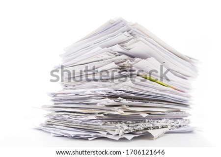 Large pile of waste paper isolated on white. Ready for recycling