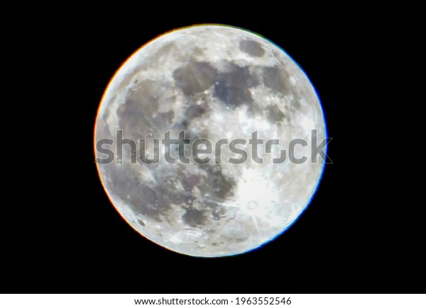 Large pink moon in a clear sky                          \
    