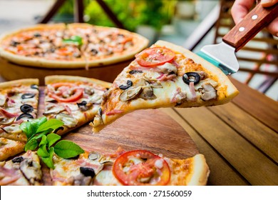 Large Pizza On A Wooden Table. Restaurant