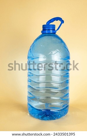 A large plastic bottle of drinking water of 5 liters. A bottle of water. The concept of quenching thirst in summer.