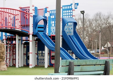 A Large Playground With A Pirate Theme. There Are Sails, A Pirates Only Sign, And Toy Cannons.