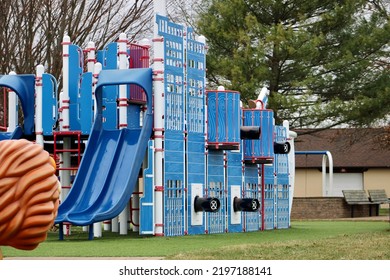 A Large Playground With A Pirate Theme. There Are Sails, A Pirates Only Sign, And Toy Cannons.