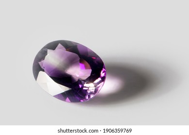 Large Polished Amethyst Gemstone Close-up On White Background