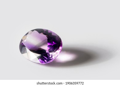 Large Polished Amethyst Gemstone Close-up On White Background