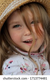 Large Portrait Of A Beautiful Girl In A Hat With Loose Curls