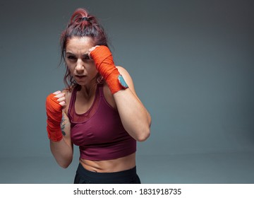 Large Portrait Of A Female Mixed Martial Arts Fighter With A Bandage On His Hands