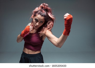 Large Portrait Of A Female Mixed Martial Arts Fighter With A Bandage On His Hands