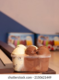 Large Pot Of Ice Cream On The Counter In An Ice Cream Shop. Copy Space.