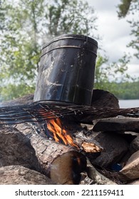 Large Pot Over A Fire In A Stone Hearth