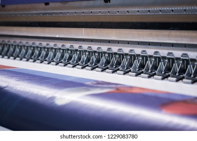 Large printer format inkjet working. - Shutterstock ID 1229083780