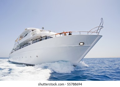 A large private motor yacht under way out at sea - Shutterstock ID 55788694