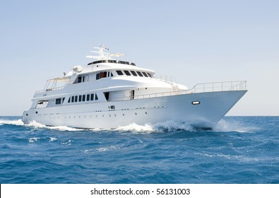 A large private motor yacht under way out at sea - Shutterstock ID 56131003