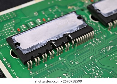 Large processor on a board with leftover thermal paste on the top.