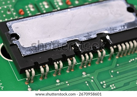 Large processor on a board with leftover thermal paste on the top.