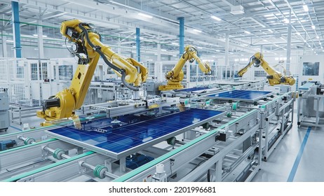 Large Production Line with Industrial Robot Arms at Modern Bright Factory. Solar Panels are being Assembled on Conveyor. Automated Manufacturing Facility